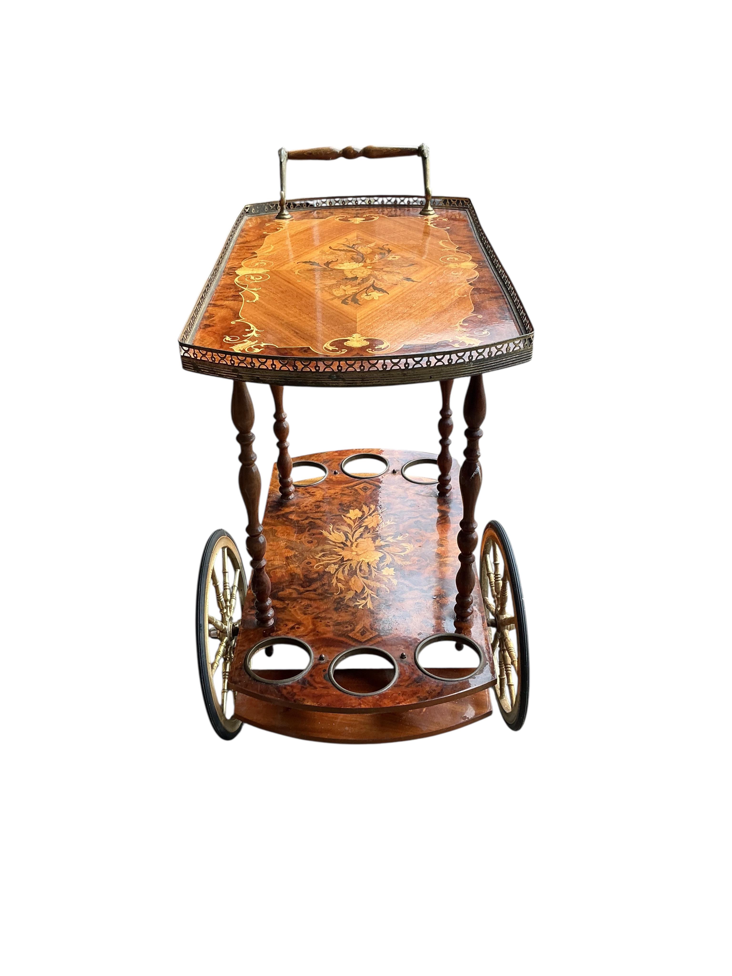 An Italian marquetry inlaid walnut two tier drinks trolley, width 79cm, depth 40cm, height 79cm